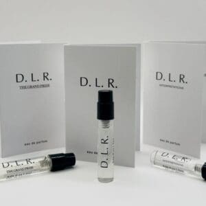 A set of three books and two tubes with the letters d. L. R.