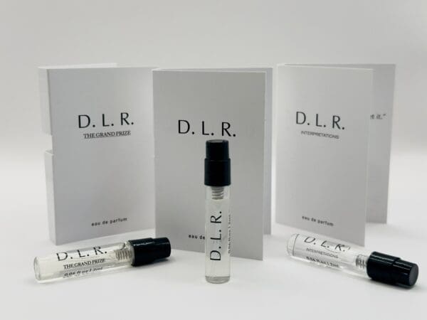 A set of three books and two tubes with the letters d. L. R.